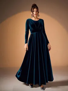 Elegant emerald green velvet long-sleeved evening gown with pleated waist detail