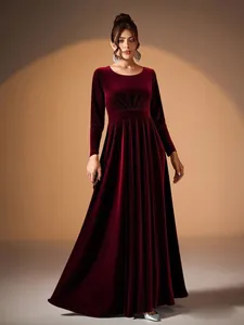 Elegant burgundy velvet long sleeve evening gown featuring a pleated waist and floor-length skirt