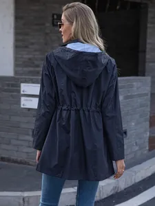 Back view of a women's longline navy blue hooded raincoat featuring a drawstring waist