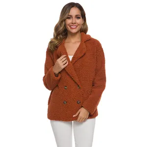 Cozy brown-orange lambswool jacket with lapel and double-breasted design on female model