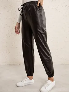 Women's black PU leather joggers with elastic drawstring waist and tapered cuffs