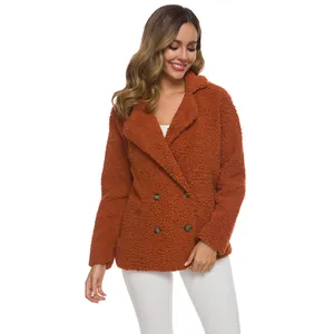 Detail view of women's rust-colored double-breasted fleece teddy coat with cozy lapels