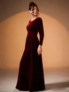 Elegant burgundy velvet long sleeve evening maxi dress featuring a pleated skirt detail
