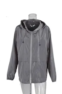 Detailed close-up of a lightweight gray hooded windbreaker jacket on a mannequin