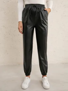 Casual women's black PU leather joggers with elastic drawstring waist and cuffed ankles