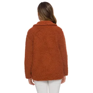 Back view of a cozy rust women's teddy fleece jacket with thick textured fabric.