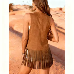 Back view of a bohemian brown suede fringe vest for women in a desert setting.
