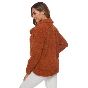 Detailed back view of a women's rust orange faux shearling fleece jacket with lapel collar