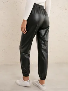 Detail view of black high waisted PU leather jogger pants showing material texture