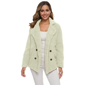 Detail view of double-breasted teddy fleece jacket featuring soft faux shearling texture.