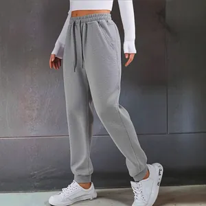 Stylish women's gray drawstring joggers for casual autumn and winter sports wear