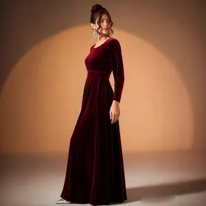 Elegant burgundy gold velvet evening gown with long sleeves and pleated waist