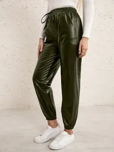 Detail of olive green PU leather joggers with drawstring elastic waist for women