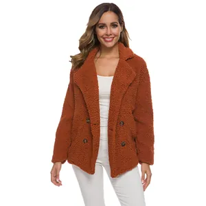 Detailed view of women's double-breasted teddy fleece jacket featuring cozy texture