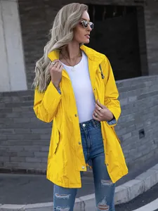 Detailed view of women's bright yellow long hooded zip-up raincoat jacket