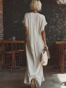 Back view of a loose elegant linen cotton maxi dress with lace trim detail on sleeves