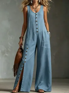 Full body view of a light blue linen sleeveless jumpsuit with front button details