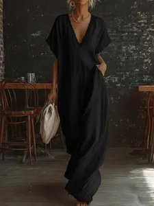 Elegant black cotton-linen maxi dress featuring delicate lace trim at V-neck and sleeves