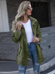 Close-up of stylish women's olive green hooded mid-length zipper raincoat jacket outdoors