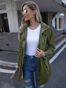 Detail of women's olive green hooded raincoat showing front zipper and snap buttons