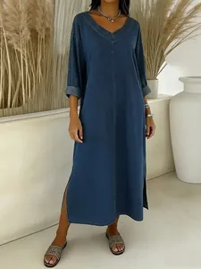 Loose V-neck mid-sleeve faux denim maxi dress with side slits in a minimalist setting