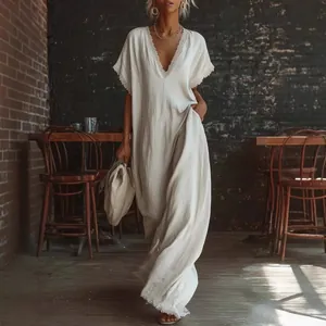 Elegant white linen cotton maxi dress with V-neck and delicate lace trim detail