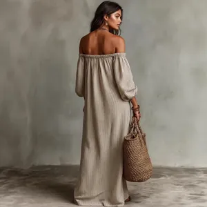 Back view of a striped off-the-shoulder maxi dress with puff sleeves for vacation.