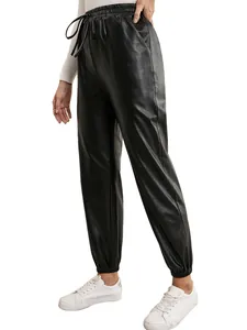 Detailed side view of women's black PU leather joggers with elastic drawstring waist