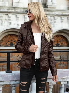 Detail of a brown hooded faux leather jacket for women in an outdoor city setting.