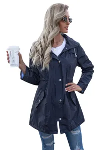 Model in navy blue mid-length hooded waterproof raincoat with drawstring waist