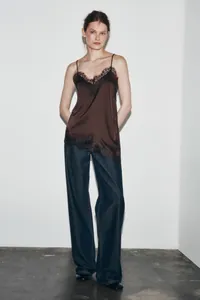 Elegant chocolate brown silk camisole with black lace trim and asymmetrical hem