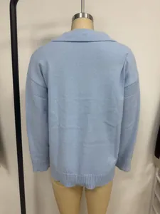 Detailed back view of a light blue knitted polo sweater on mannequin with rib cuffs