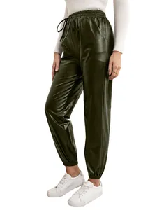Detailed view of women's dark green PU leather jogger pants with elastic drawstring waist