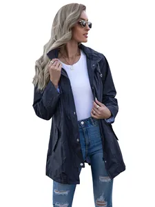 Stylish navy blue mid-length hooded raincoat worn by a model with casual outfit detail