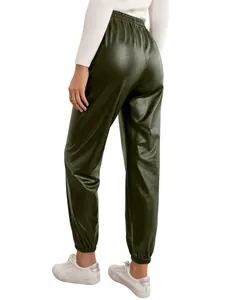 Close-up back view of olive green faux leather pants showing texture and waist.