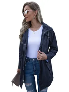 Detail view of navy blue hooded windbreaker jacket with zipper closure and waist drawstring