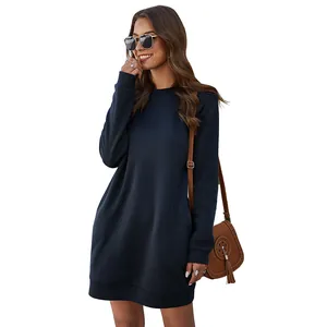 Woman wearing navy blue long sleeve crew neck sweatshirt dress on white background