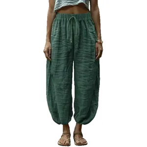 Women's loose green cotton linen lantern pants with a comfortable drawstring waist