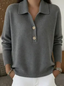 Detail of grey knit polo sweater featuring a ribbed collar and two-button placket