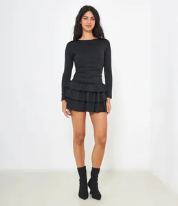 Full-length view of a stylish slim fit black long-sleeve dress with a ruffled skirt.
