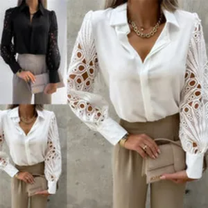 Elegante Damenbluse mit Knöpfen und filigranen, durchbrochenen Spitzenärmeln Details.