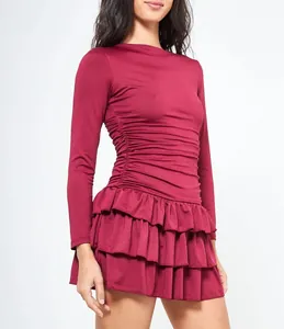Elegant burgundy long sleeve slim fit mini dress with tiered ruffles and side ruching.