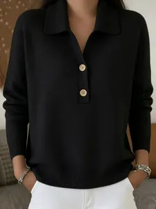 Detail view of a black women's knit sweater featuring a polo collar and buttons
