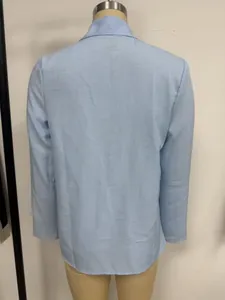 Back view of a light blue long-sleeved loose casual shirt for women with collar