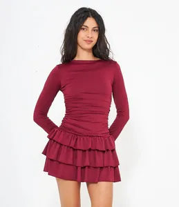 Detailed shot of burgundy long sleeve slim fit mini dress with layered ruffles