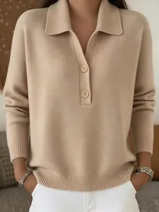 Close-up detail of a beige knit polo sweater featuring a buttoned collar and ribbed texture.
