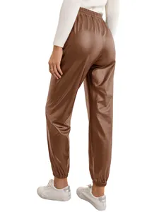 Close-up back view of women's brown faux leather joggers with elastic waist and cuffs