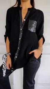 Detail view of black long sleeve shirt with sequined pocket and placket