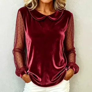 Elegante bordeauxrode fluwelen top met Peter Pan kraag en mesh mouwen met stippen print