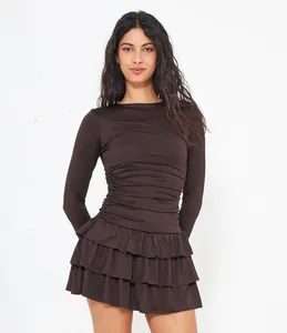 Front view of slim fit long sleeve brown dress with ruffled hem detailing